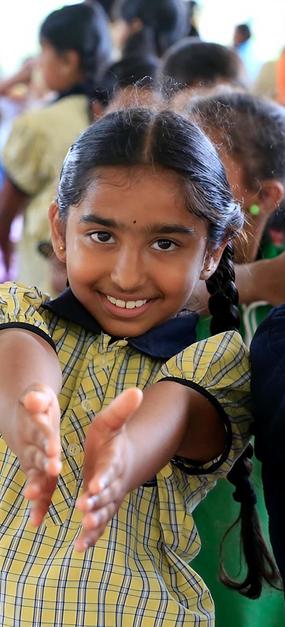 school students extending hands